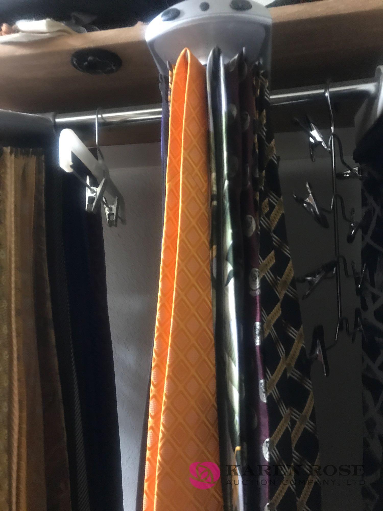 Rotating tie rack with designer ties