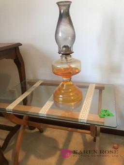 glass top small table with oil lamp