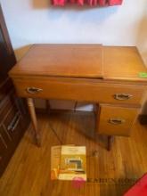 vintage sewing table with singer sewing machine
