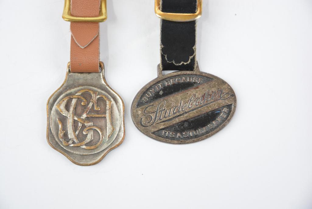 2- Studebaker Metal Watch Fobs