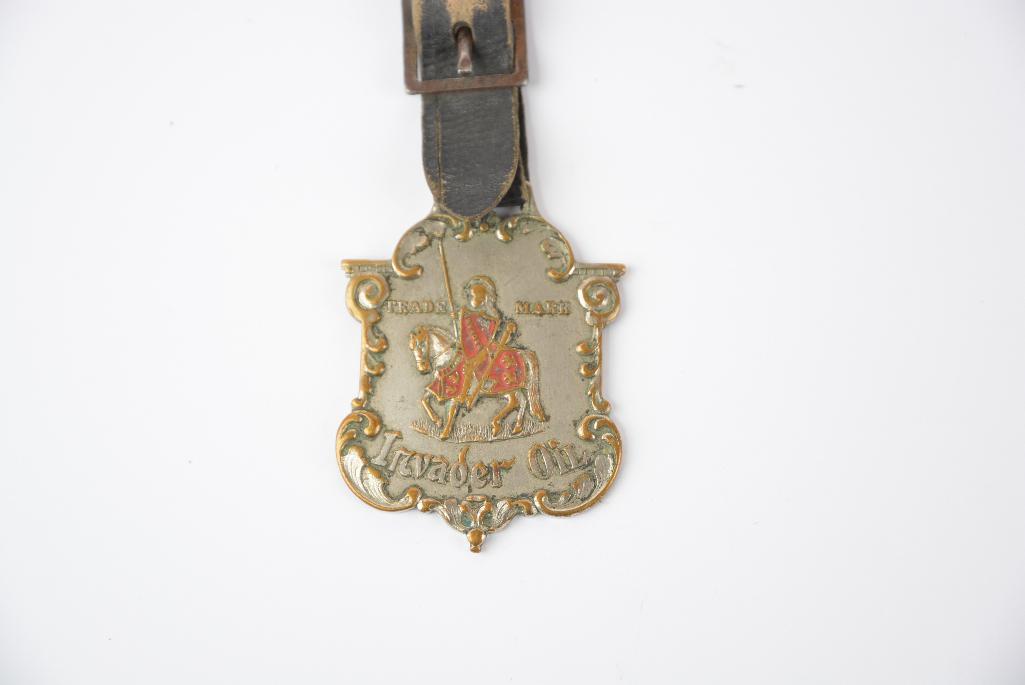 Invader Oil w/Knight on horse back trade mark enamel metal watch fob