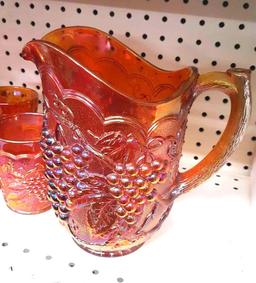 Carnival glass pitcher with 4 glasses