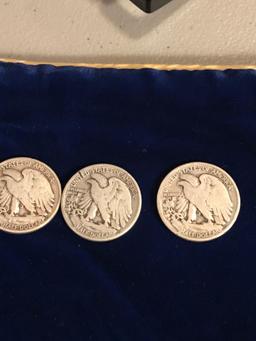 Seven liberty half dollars