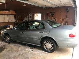 2003 Buick four-door custom in garage