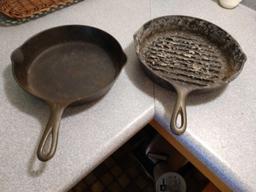 2 cast iron frying pans