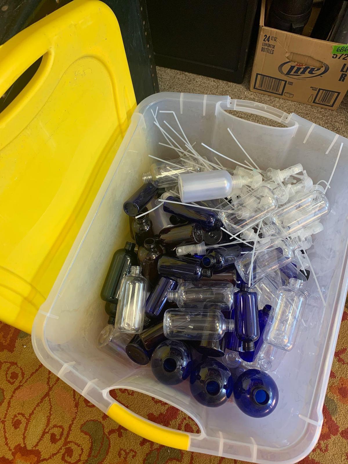 Storage tote of plastic squirt bottles