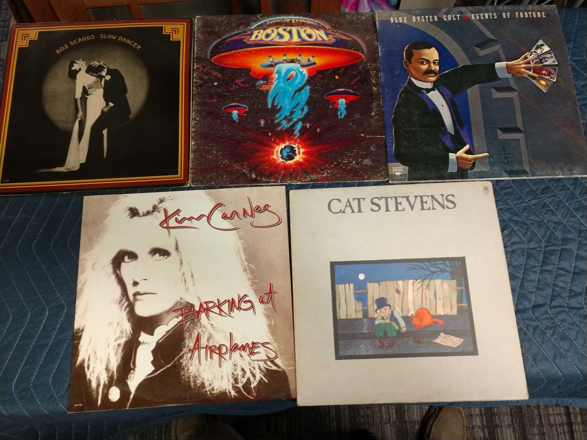 Five record albums including cat Stevens, Kim carnes, Boston, Blue oyster cult, and Boz scaggs