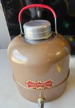 Vintage little brown jug thermos.