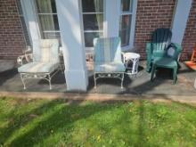 Lawn chairs and side tables on porch.