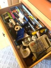 contents of kitchen drawer pens tape and more
