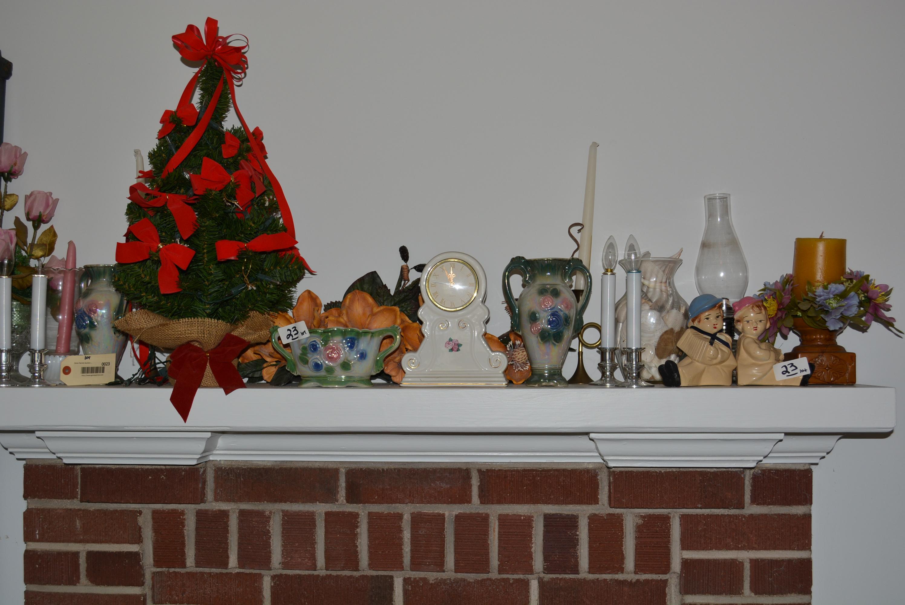 LOT OF DÉCOR ON FIREPLACE MANTEL