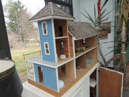 Wooden cabinet with doll house and accessories