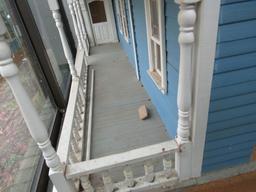 Wooden cabinet with doll house and accessories