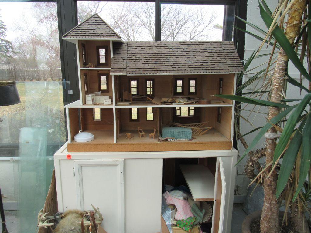 Wooden cabinet with doll house and accessories