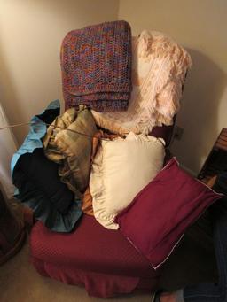 Chair, pillows, and afghans