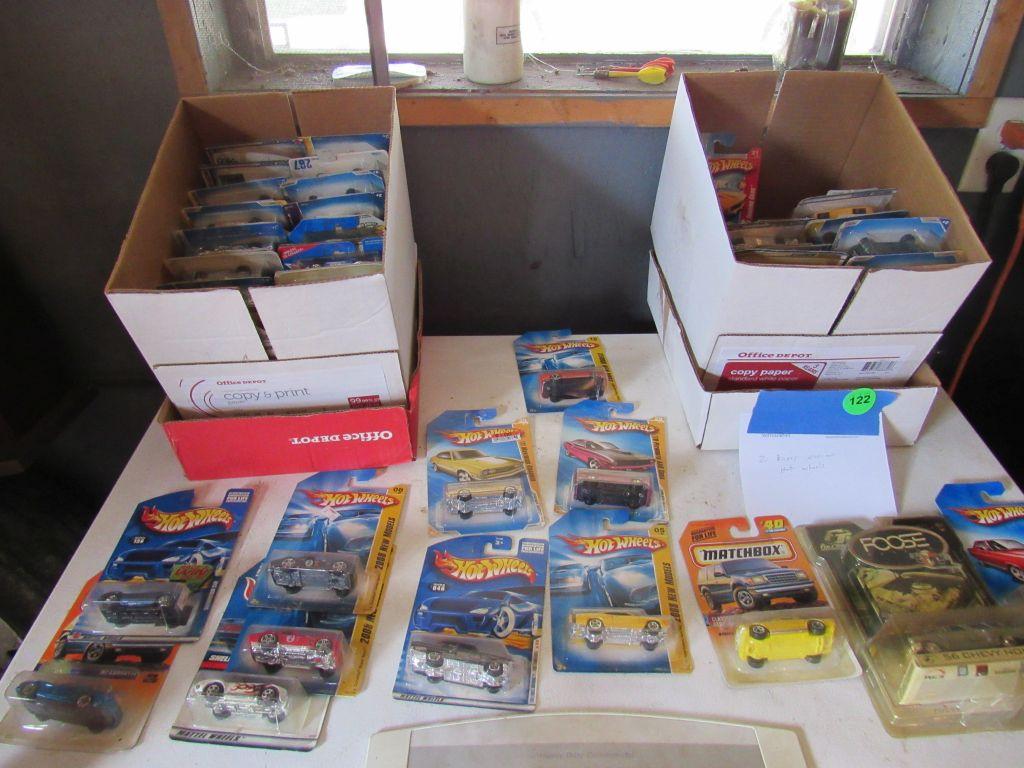 2 boxes of various hot wheels