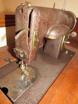 Kenmore sewing machine with cabinet