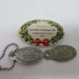 Three Sheboygan Falls bank advertising items, pocket mirror and key tags