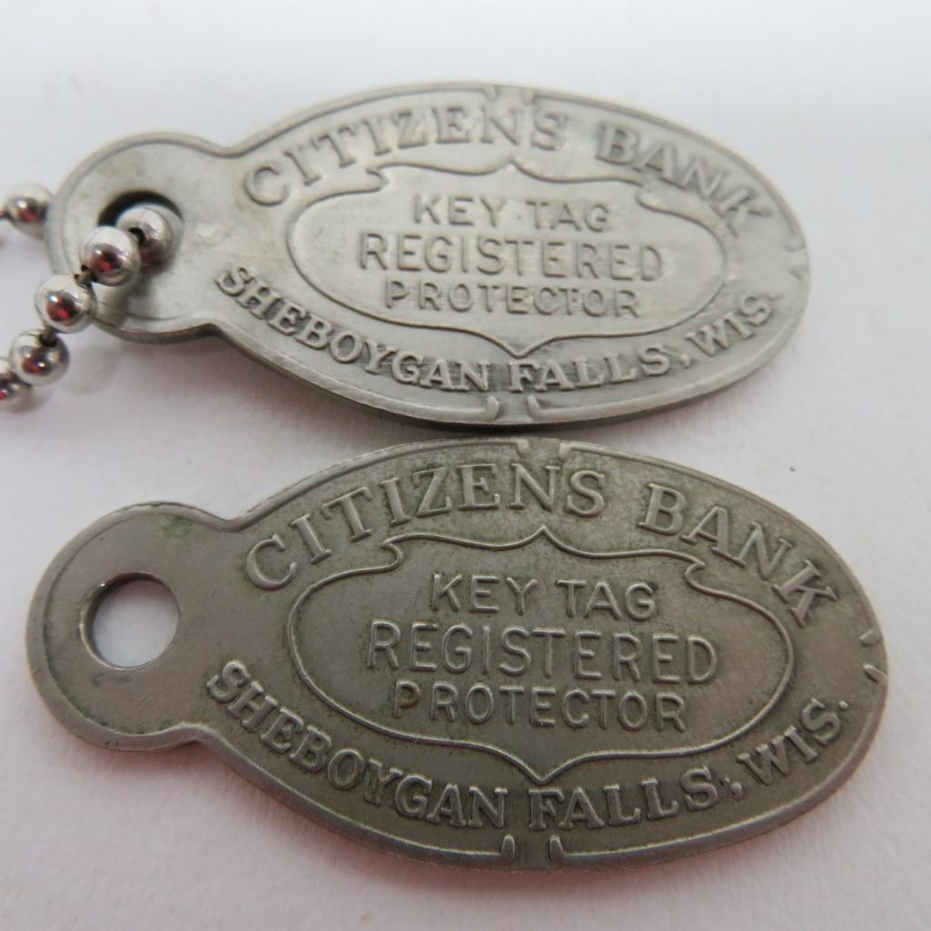 Three Sheboygan Falls bank advertising items, pocket mirror and key tags