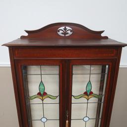 Ornate leaded glass two door cabinet