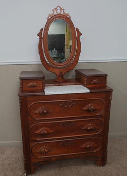 Ornate fruit carved walnut dresser with marble inset and mirror