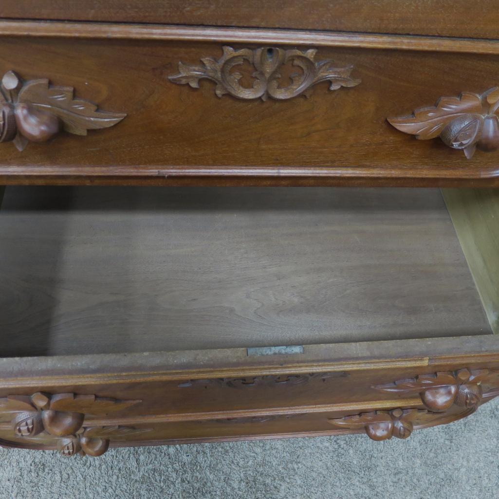 Ornate fruit carved walnut dresser with marble inset and mirror