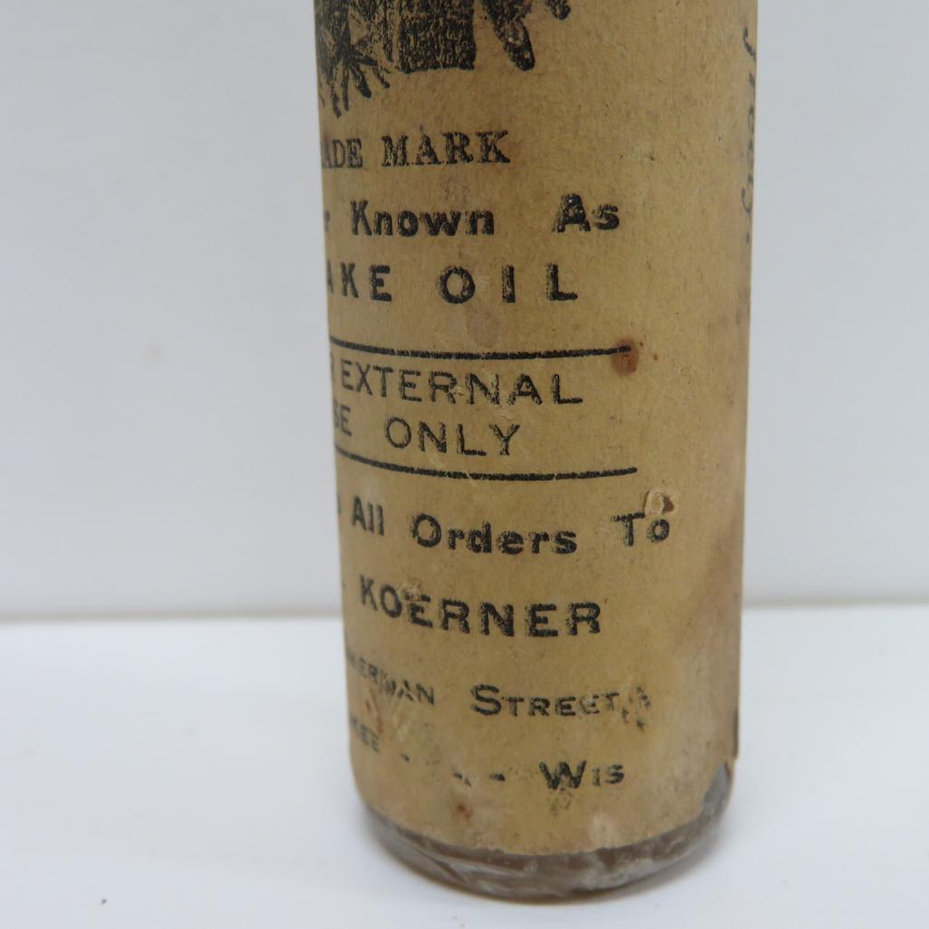 Antique Snakeoil bottle with original paper label