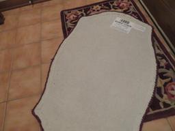 Two Wool contour sculptured scatter rugs