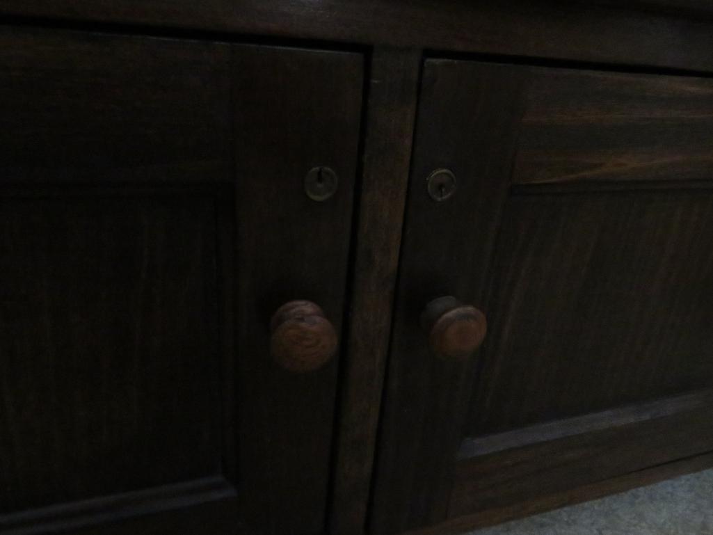 Unusual tall roll front cabinet