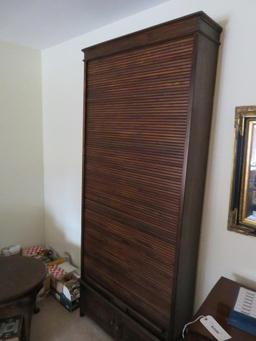 Unusual tall roll front cabinet