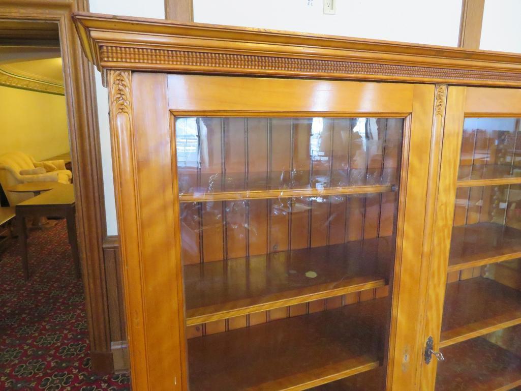 Beautiful maple two door bookcase with two drop down doors and carving