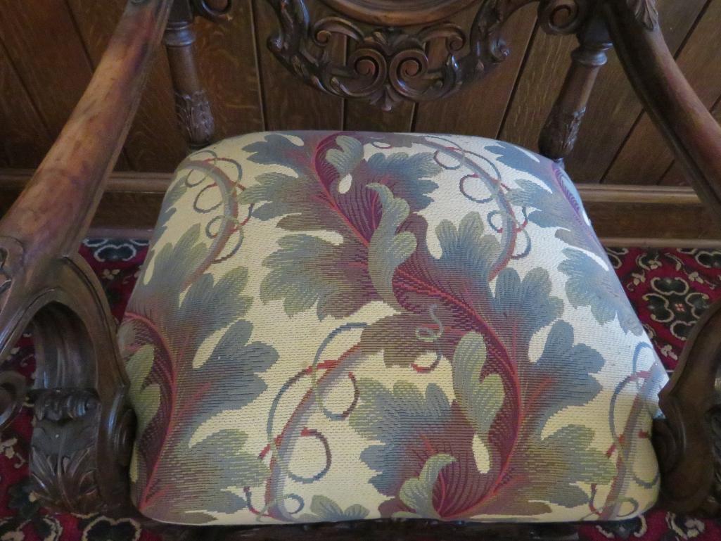 William and Mary style heavily carved side chair with a botanical upholstery seat