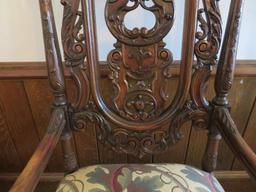 William and Mary style heavily carved side chair with a botanical upholstery seat