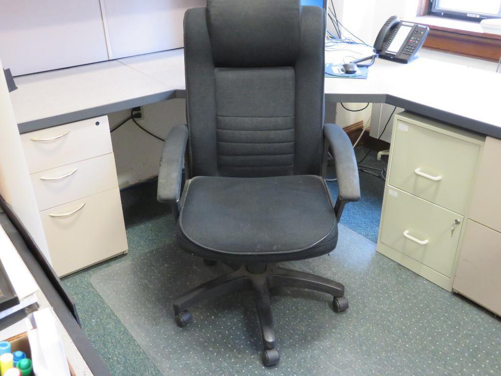 Office cubicle with upper cabinets and files