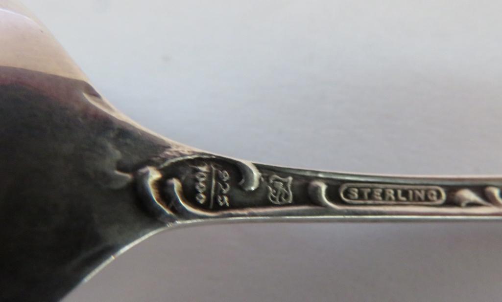 For Sterling souvenir spoons, for from Wisconsin and one from Virginia