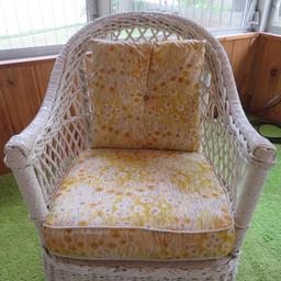 White Wicker rocking chair with cushion and pillow