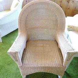 White Wicker rocking chair with cushion and pillow