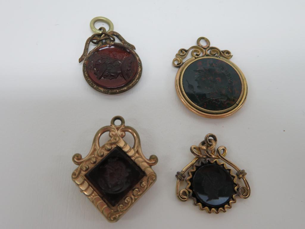 Four antique intaglio pendant fobs