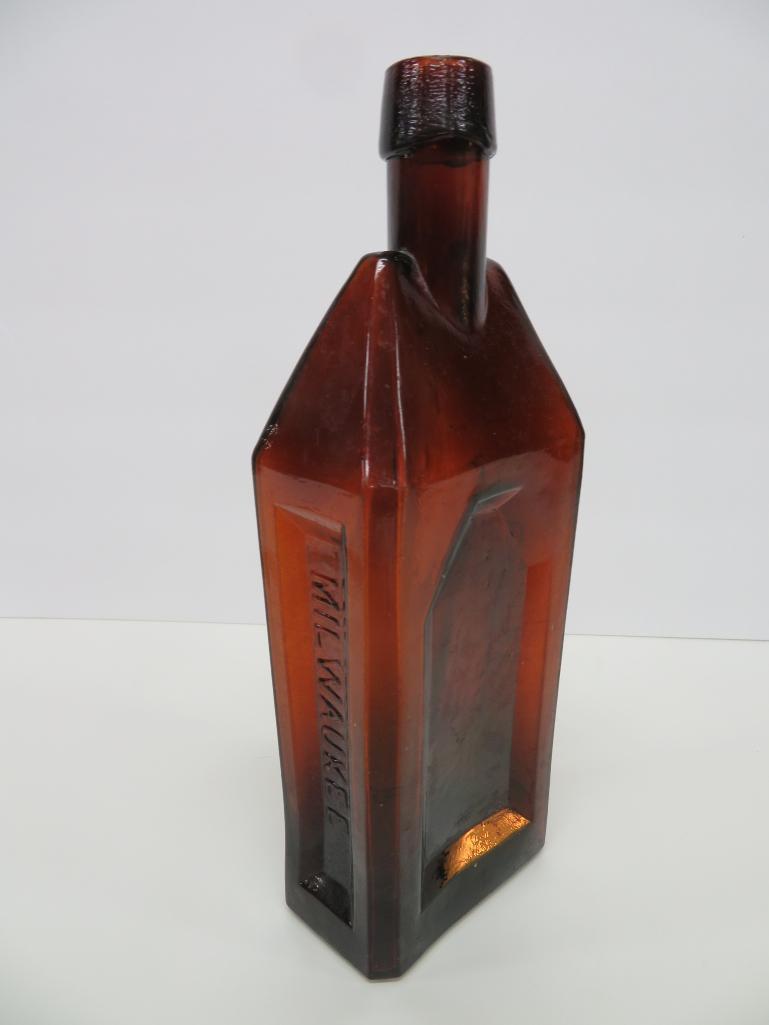 E Schneiders amber whiskey bottle, 10"