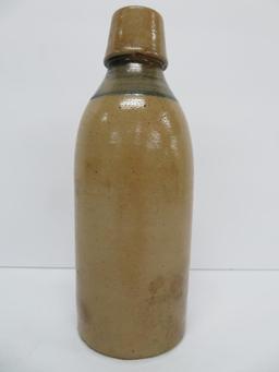 El Husting Milwaukee Stoneware bottle with blue band, 8"