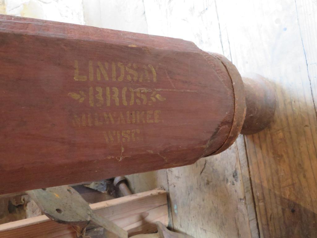 Lindsay Bros Milwaukee stenciled wooden pump, 89" tall