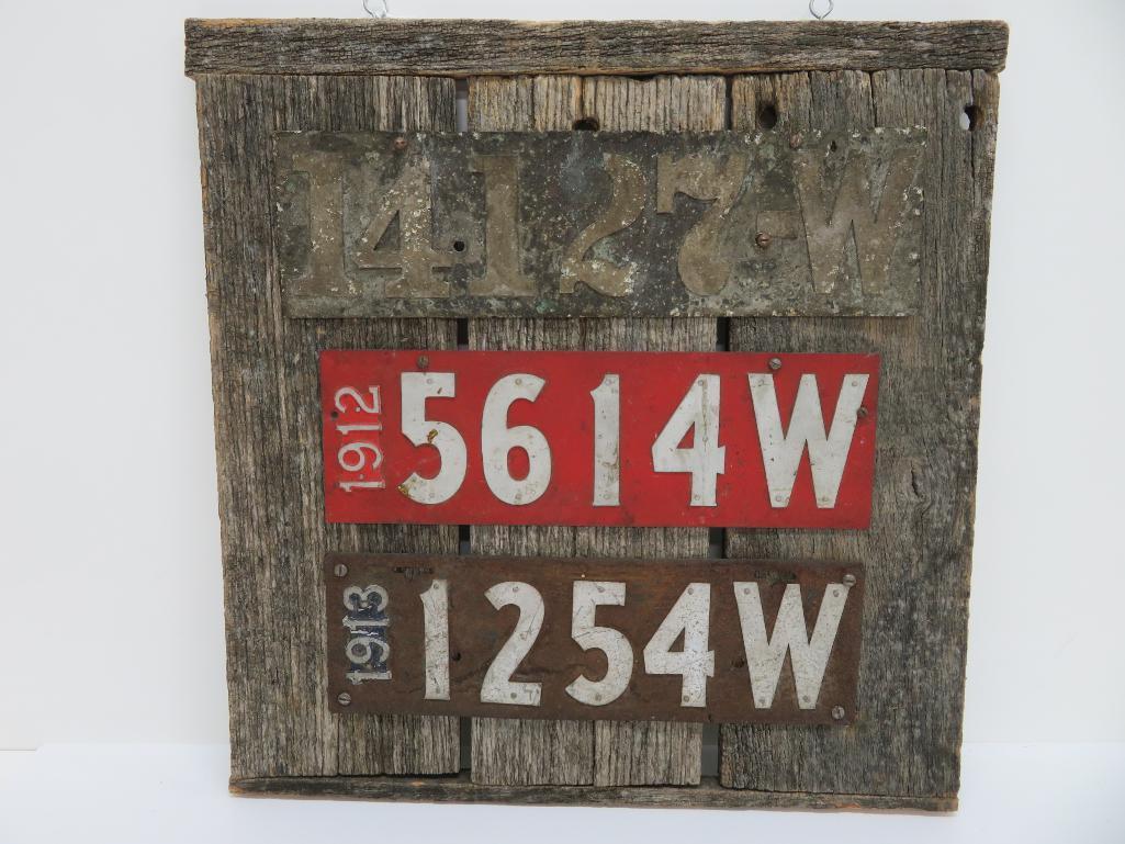 Three early 1900 metal license plates