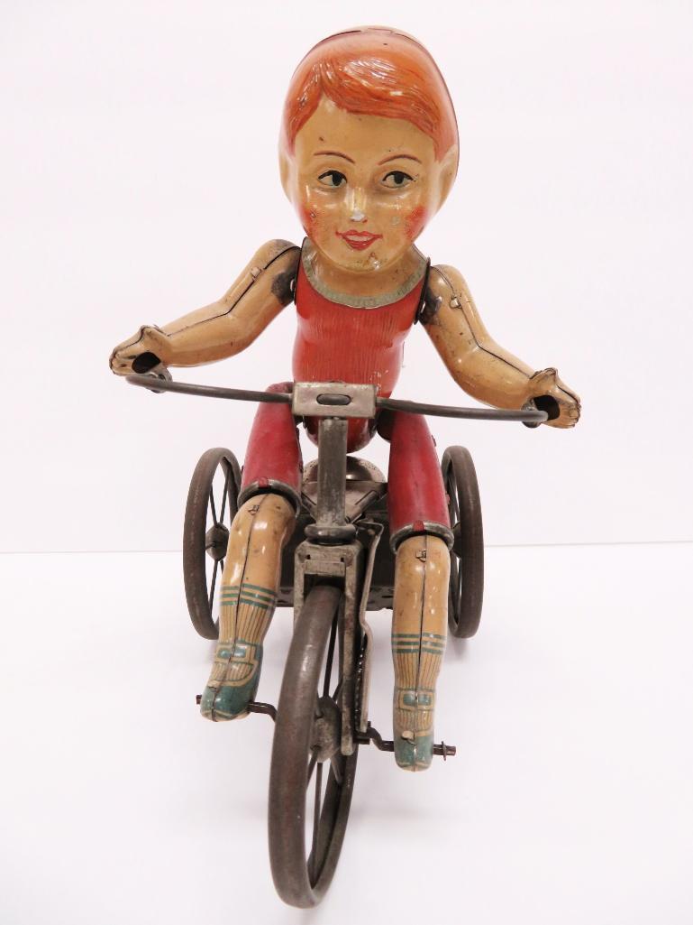 Hard to find Marx Wonder Cyclist, tin wind up boy on tricycle with spoke wheels, c 1920, 1st version