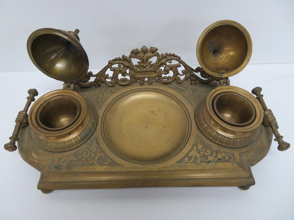 Ornate double metal inkwell with pen tip tray