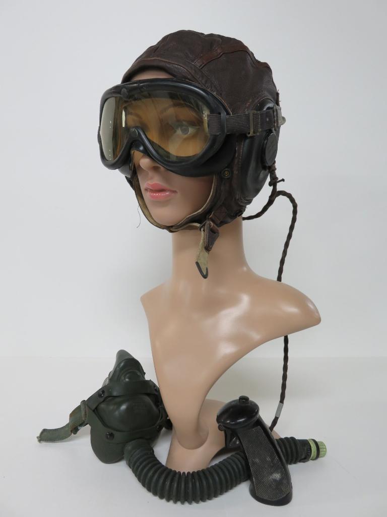 WWII Leather aviator-pilot cap, googles, oxygen mask and control stick handle