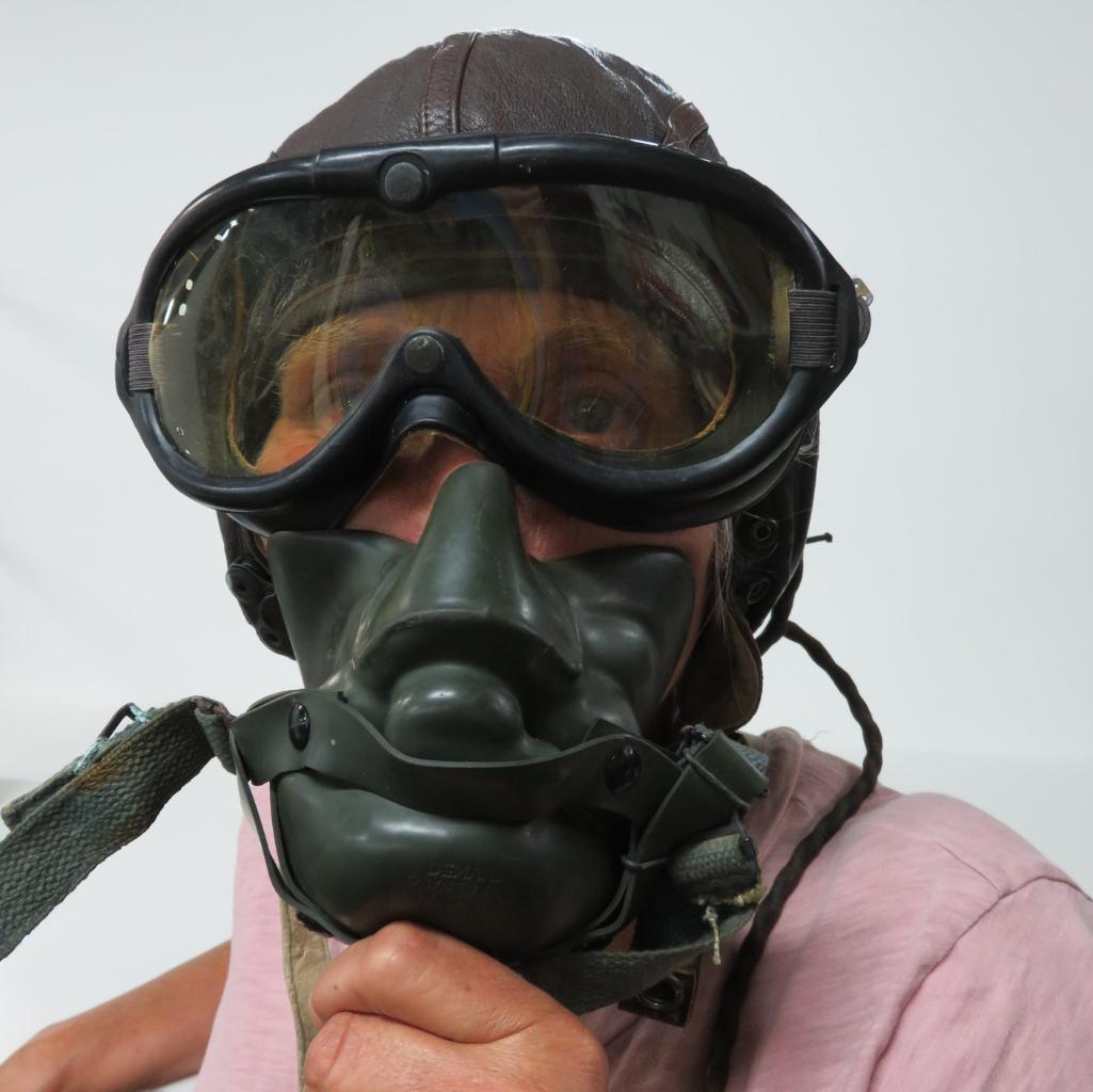 WWII Leather aviator-pilot cap, googles, oxygen mask and control stick handle