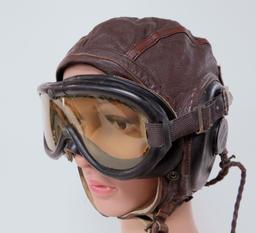 WWII Leather aviator-pilot cap, googles, oxygen mask and control stick handle