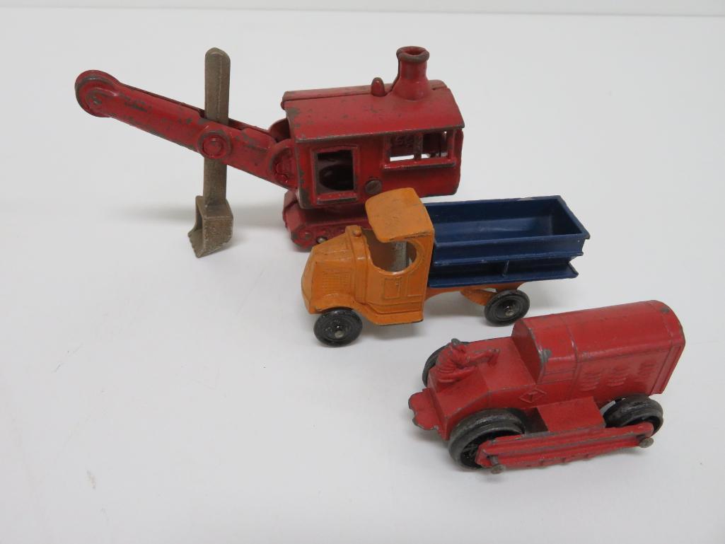 Three cast iron and Tootsie Toy commercial vehicles