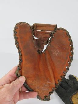 Two vintage baseball gloves, McKinnon and Winfield