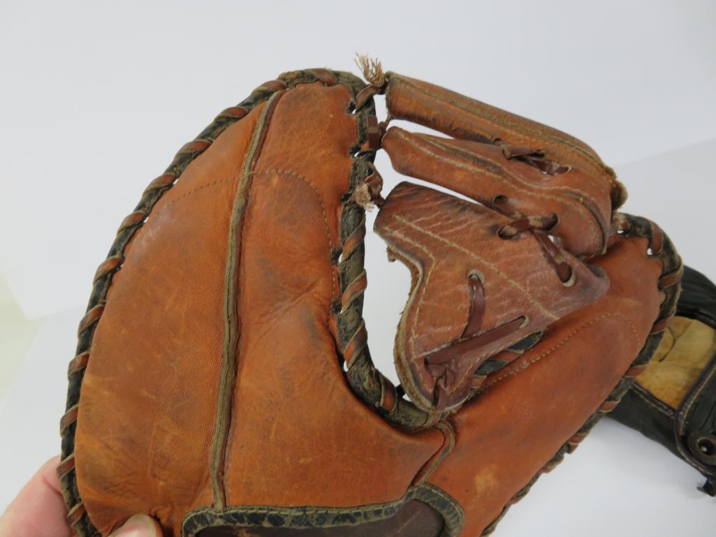 Two vintage baseball gloves, McKinnon and Winfield